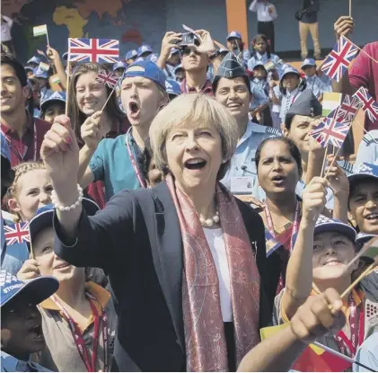  ??  ?? 0 Theresa May, seen waving a Union Jack during a visit to Bangalore, India, insists Brexit can be a success