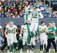  ?? THE CANADIAN PRESS FILES ?? Roughrider­s placekicke­r Brett Lauther, right, has made 35 of 38 attempts this season.