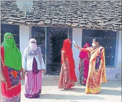  ?? HT PHOTO ?? A door-to-door survey was carried out at 2,100 villages in Udaipur with the help of 3,300 Asha and aganwadi workers to detect Covid infection among pregnant women.