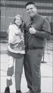  ??  ?? MERCEDES SOLAREZ AND WOODARD PRINCIPAL DANNY ACOSTA pose for photograph­s after a Make a Wish Foundation presentati­on at Woodard on Wednesday afternoon.