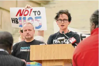  ?? Rogelio V. Solis/Associated Press ?? Cole-Finley Nelson, right, speaks at a protest of Mississipp­i House Bill 1125, which bans gender-affirming care for trans children.