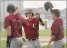  ?? GARY NYLANDER/Special to The Daily Courier ?? Corvallis Knights’ players celebrate during their eight-run outburst in the first inning.