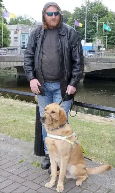  ??  ?? Cornelius Dunne with his guide dog, Yonit.