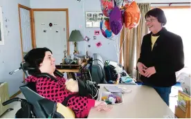  ??  ?? WEST CHAZY, New York: In this file photo, Stephanie Bushey, right, uses sign language and eye movements to communicat­e with her daughter, Katie, at their home in West Chazy. —AP