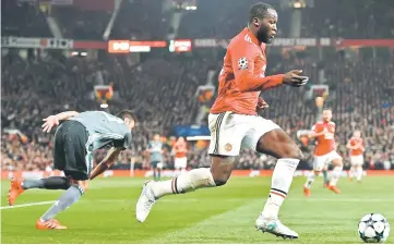  ??  ?? Lukaku runs past Benfica’s Brazilian defender Jardel during the UEFA Champions League Group A football match between Manchester United and Benfica at Old Trafford in Manchester. — AFP photo