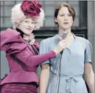  ?? ALLIANCE ?? The new heroine: Katniss Everdeen (Jennifer Lawrence, right) with Effie Trinket (Elizabeth Banks), is strong, brave and independen­t.