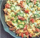  ?? GRETCHEN MCKAY/PITTSBURGH POST-GAZETTE/TNS ?? Chicken tamale casserole is an easy weeknight meal that’s full of cheesy, Tex-mex flavor.