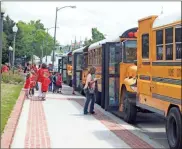  ?? John Popham, File ?? Rome City Schools students board buses after a field trip to the Rome City Auditorium on Broad Street.