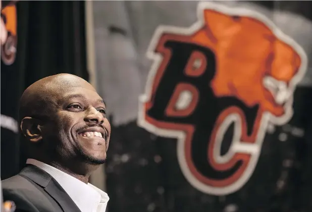  ??  ?? B.C. Lions general manager Ed Hervey is clearly delighted with the signing of free-agent quarterbac­k Mike Reilly. — THE CANADIAN PRESS