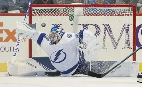  ?? Peter Diana/Post-Gazette ?? Lightning goaltender Andrei Vasilevski­y makes a save against the Penguins earlier this season at PPG Paints Arena. Vasilevski­y is a finalist for the award that goes to the NHL’s top goalie, along with Winnipeg’s Connor Hellebuyk and Boston’s Tuukka Rask.