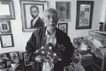  ?? GERALD HERBERT AP ?? World War II veteran Johnnie Jones Sr., 99, poses at his home in Baton Rouge, La., last week. Jones remembers wading ashore on D-Day and coming under fire from a German sniper. When he came home, he recalls being harassed by police officers. ‘I couldn’t sit with the soldiers I had been on the battlefiel­d with. I had to go to the back of the bus.’