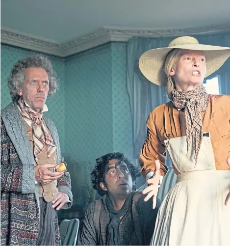  ??  ?? Hugh Laurie as Mr Dick, Dev Patel as David Copperfiel­d and Tilda Swinton as Betsey Trotwood.