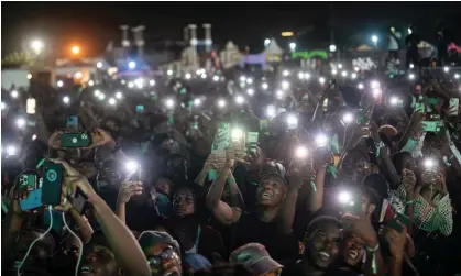  ?? Photograph: Ernest Ankomah/Getty Images ?? Young people holding up their phones in Accra, Ghana, during an Afrobeats concert in December 2023. Ghana is among the countries experienci­ng an internet outage.