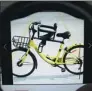  ?? PROVIDED TO CHINA DAILY ?? A child seat installed on an Ofo shared bicycle. Such seats are available on Taobao.