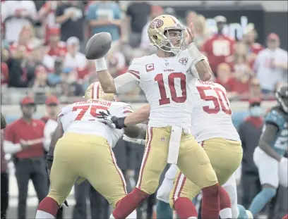  ?? PHOTOS BY PHELAN M. EBENHACK — THE ASSOCIATED PRESS ?? Niners quarterbac­k Jimmy Garoppolo has thrown only 67 passes during the team’s current three-game win streak.