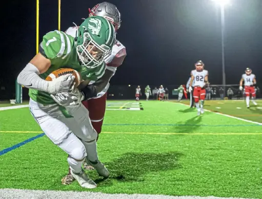  ?? Steph Chambers/ Post- Gazette ?? South Fayette’s Charley Rossi catches a touchdown pass against West Allegheny’s Nodin Tracy.