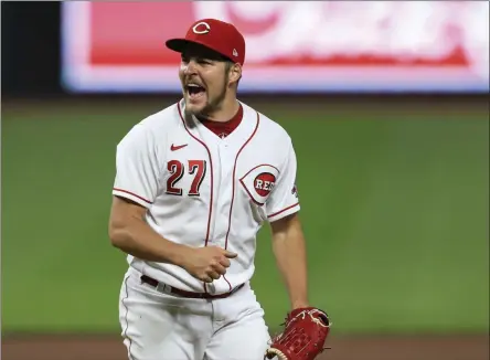  ?? AARON DOSTER - THE ASSOCIATED PRESS ?? FKILE - Cincinnati Reds’ Trevor Bauer reacts after recording a strikeout against Milwaukee Brewers’ Christian Yelich during a baseball game in Cincinnati, in this Wednesday, Sept. 23, 2020, file photo.