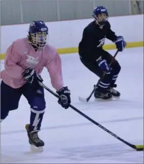  ?? STAN HUDY SHUDY@DIGITALFIR­STMEDIA.COM @STANHUDY ON TWITTER ?? A member of the Saratoga Springs ice hockey ‘Pink’ line skates the puck up the ice during practice at the Saratoga Springs Ice Rink.