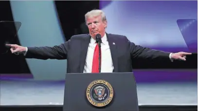  ?? John Raoux ?? The Associated Press President Donald Trump addresses the Internatio­nal Associatio­n of Chiefs of Police at their convention Monday in Orlando, Fla.