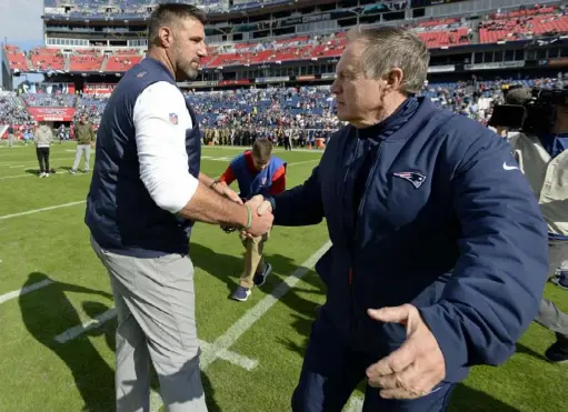  ?? Associated Press ?? Mike Vrabel, left, greets Bill Belichick before the Titans played the Patriots in 2018 in Nashville. Student schooled teacher that day, as the Titans won, 34-10. Saturday, the two teams meet again in an AFC wild-card game.