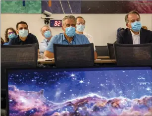  ?? KARL MONDON — BAY AREA NEWS GROUP ?? Members of Lockheed Martin’s Advanced Technology Center in Palo Alto, Calif., watch as NASA reveals the first images of the James Webb Space Telescope, on Tuesday.