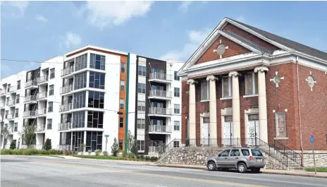  ?? PHOTOS BY LARRY MCCORMACK, THE TENNESSEAN ?? First Baptist Church East Nashville is in a time of transition because the neighborho­od has changed, and it’s trying to reach new residents. Next door is a high-rise apartment building; behind is Section 8 housing.