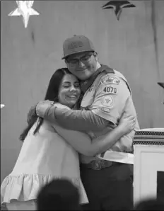  ?? COURTESY PHOTO ?? Dominic Fiorenza hugs Dallana Gomez, culinary arts instructor at Calipatria High School, after presenting her with a Mentor Pin during his Eagle Scout Court of Honor on Feb. 1.