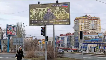  ??  ?? This file photo shows a billboard featuring the leader of the self-proclaimed Donetsk People’s Republic (DNR) Alexander Zakharchen­ko (centre) in Donetsk on March 18, 2015. The Russian text on the billboard reads: ‘We are grateful to the defenders of...