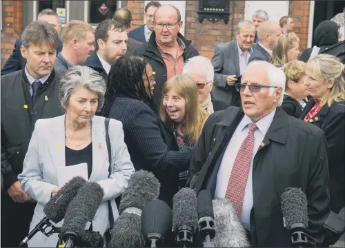  ?? PICTURE: JAMES HARDISTY ?? LONG FIGHT: Relatives of the Hillsborou­gh dead, including Trevor Hicks, right, speak to the media after the Crown Prosecutio­n Service announceme­nt in Warrington.