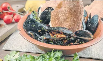  ??  ?? Stewed black mussels with spicy n’duja sauce.