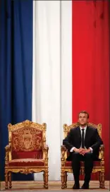  ?? The Associated Press ?? French President Emmanuel Macron listens as Paris Mayor Anne Hidalgo delivers her speech during a ceremony at the Hotel de Ville in Paris on Sunday.