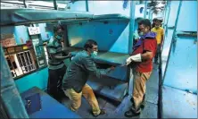  ?? P. RAVIKUMAR / REUTERS ?? Workers remove berths from a passenger train to install as beds in an isolation facility to be set up in the train amid concerns over the coronaviru­s in Chennai, India, on Monday.