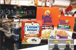  ?? Associated Press photo ?? Cream of Wheat packaging along with Uncle Ben’s rice is shown Thursday in Jackson, Miss. Cream of Wheat and Mrs. Butterwort­h are the latest brands reckoning with racially charged logos. The soulsearch­ing comes in the wake of PepsiCo’s announceme­nt Wednesday that it’s renaming its Aunt Jemima syrup brand.