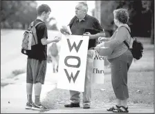  ?? NWA Democrat-Gazette/JASON IVESTER ?? The Rev. Dale Jirousek (center), pastor of Peace Lutheran Church in Rogers, and his wife, Jan Jirousek, talk Wednesday to Rogers Heritage High School freshman Brett Lemmond about the church’s “Way Out Wednesdays,” an after-school program for teens.