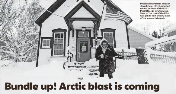  ?? MIKE GROLL, AP ?? Postal clerk Pamela Bentley shovels lake-effect snow last month in front of the U.S. Post Office in Grafton, N.Y. Most of the rest of the USA will get its first wintry blast of the season this week.