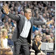  ?? AP/JESSICA HILL ?? Connecticu­t Coach Geno Auriemma calls out to his players during the No. 1 Huskies’ victory over Oklahoma on Tuesday night. It was Auriemma’s 1,000th career victory.