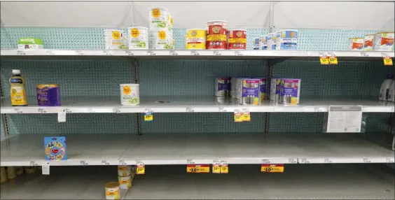  ?? AP ?? NOT MUCH THERE: Baby formula is displayed on the shelves of a grocery store in Carmel, Ind., on Tuesday.