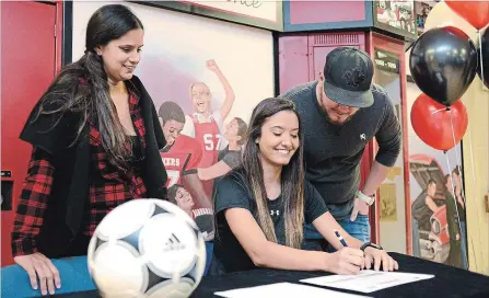  ?? IAN STEWART SPECIAL TO THE RECORD ?? Kaylee Bruce, a Grade 12 student at Glenview Park Secondary in Cambridge, signs a commitment to East Central University in Ada, Oklahoma, to play soccer. She was joined by mom Betty Filmore and dad Aaron Bruce.