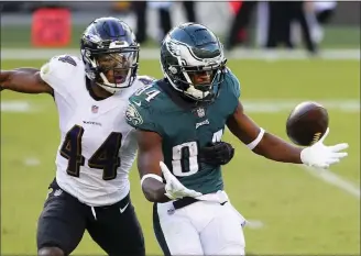  ?? RICH SCHULTZ - ASSOCIATED PRESS ?? The Eagles’ GregWard ( 84) can’t hold onto a pass as the Ravens’ Marlon Humphrey ( 44) defends during the third quarter Sunday.