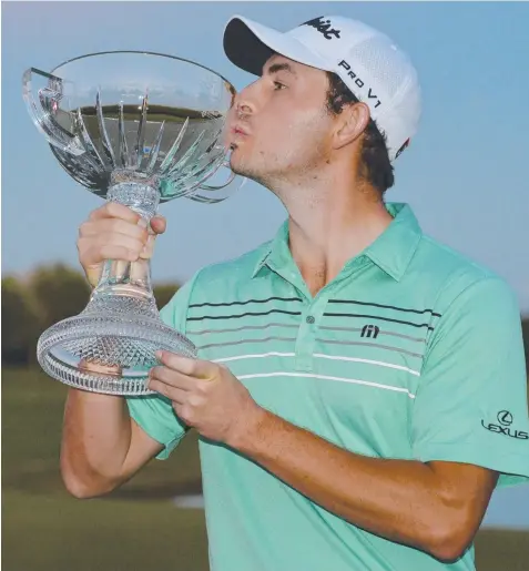  ??  ?? COMEBACK KING: Patrick Cantlay kisses his trophy after winning the Shriners Hospitals For Children Open at the TPC Summerlin.