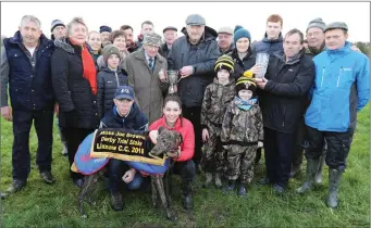  ??  ?? John O’Keeffe and Pat McCarthy receiving the cup from Moss Joe Brown and Patricia Foley, sponsor of the cup, after John’s dog, Dresden Value, won the Dog Trial Stakes at Lixnaw coursing on Sunday.Photos by David O’Sullivan