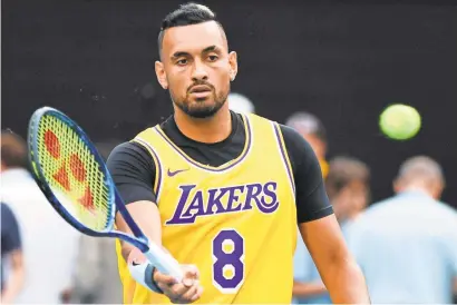  ?? USA TODAY ?? Nick Kyrgios pays tribute while warming up to play against Spain’s Rafael Nadal.