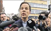  ?? CARL COURT / GETTY IMAGES ?? Dutch Prime Minister Mark Rutte speaks to the press Tuesday as he campaigns in The Hague ahead of today’s parliament­ary election.