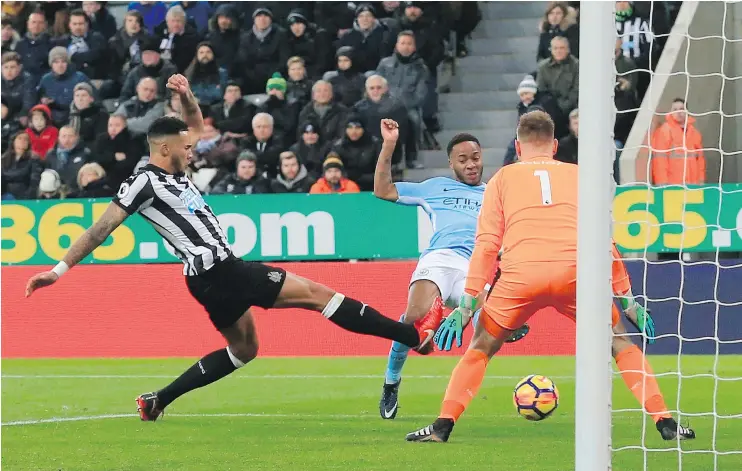  ?? — AFP/GETTY IMAGES ?? Manchester City’s Raheem Sterling, centre, scored the only goal in a tightly played Premier League game against Newcastle United on Wednesday.