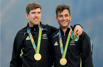  ??  ?? Peter Burling and Kerikeri’s Blair Tuke with their gold medals after winning the men’s 49er class. Bruce Burling