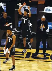  ?? GETTY IMAGES ?? Jahvon Blair #0 and Jamorko Pickett #1 of the Georgetown Hoyas celebrate the win over the Creighton Bluejays during the Big East Championsh­ip game at Madison Square Garden on March 13, 2021, in New York City. The Georgetown Hoyas defeated the Creighton Bluejays 73-48 to win the title.