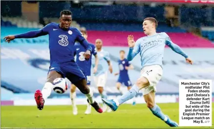  ?? AFP ?? Manchester City’s midfielder Phil Foden shoots past Chelsea’s defender Kurt Zouma (left) but wide of the goal during the English Premier League match on May 8.