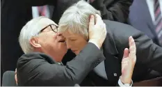  ??  ?? THERESA May is greeted by Jean-Claude Juncker in Brussels, yesterday.