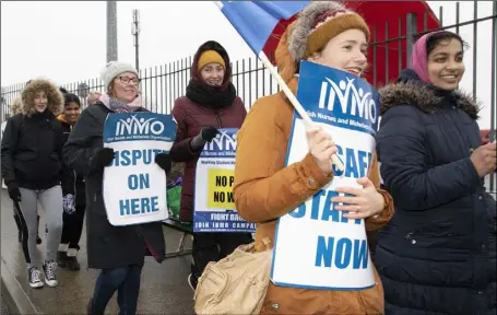  ??  ?? ABOVE AND RIGHT: Nurses on strike outside Wexford General Hospital last Tuesday.