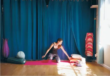  ?? Carlos Avila Gonzalez / The Chronicle ?? Dee Dassault, creator of Ganja Yoga, in a studio she uses. “When people finish a ganja yoga class, a lot of them say it’s the most relaxed they’re ever been in their lives,” she says.